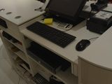 a computer desk with a keyboard and mouse on it
