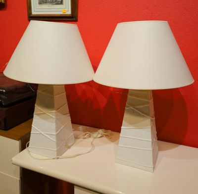 two lamps that are sitting on a white table