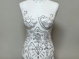 an image of a white mannequin with a black and white design