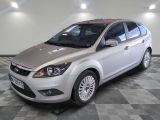 a picture of a silver ford focus parked in a garage
