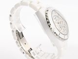 an image of a close up of a watch on a white surface