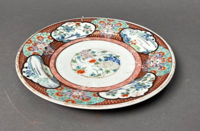a plate with a design on it sitting on a table