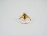 an image of a gold ring with a skull on it