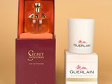 an image of a bottle of guerlain perfume next to a box