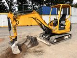 a small excavator that is sitting in the dirt