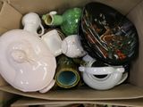 a box full of assorted dishes and cups