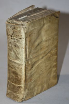 an old book that is sitting on a table