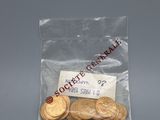 a bag of gold coins sitting on a table