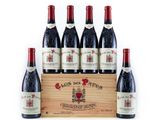 six bottles of red wine in a wooden crate on a white background