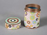 two tins that are sitting next to each other