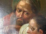 painting of a man and a woman looking at a painting of a man in a turban