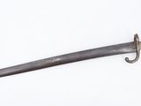 a close up of a knife on a white surface with a white background