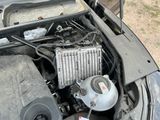 a car engine with a radiator in the hood