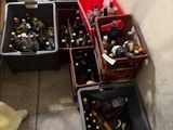 many bottles of beer in the bins on the floor