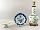 three different types of vases and a plate on the table