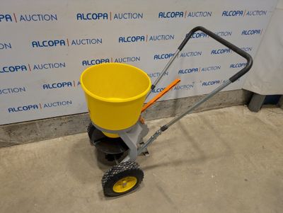 an image of a yellow bucket being pulled by a hand truck