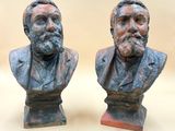 two busturines of two men with beards on each of them