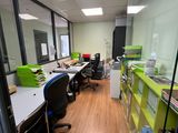 a room with a lot of desks and chairs in it