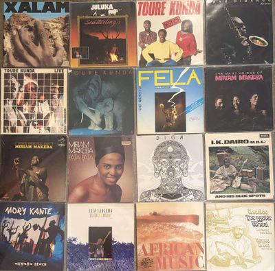 a lot of records on the wall of a room