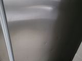 an image of a stainless steel refrigerator in a kitchen