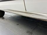 a close up of a car ' s side with a flat tire