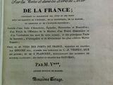 un livre ouvert sur lequel figure la photo d'un homme
