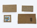 four pieces of brown paper with blue and white designs on them