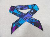 purple, blue, and black tie with a picture of a robot on it