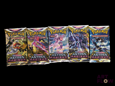 four packs of pokemon cards are lined up on a black background