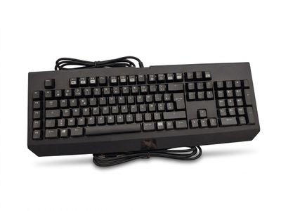 a computer keyboard with a cord attached to it