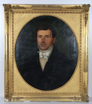 portrait of a man in a black suit with a white bow tie