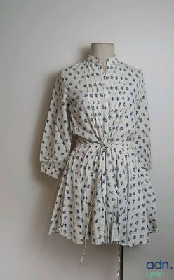 an image of a dress on a mannequin stand