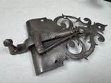 a metal latch that is on a white table