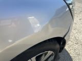 a close up of a car ' s front bumper and fender