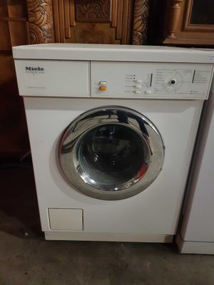 an image of a white washer and dryer sitting next to each other