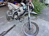 a motorcycle that is parked on the side of the road