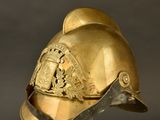 helmet of a fireman with a golden helmet on a black background