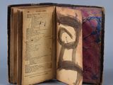 an open book with a drawing of a man on it