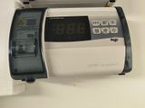 a clock that is on the side of a machine