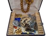 a box with a bunch of jewelry inside of it