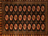 a black rug with red and gold medallions on it