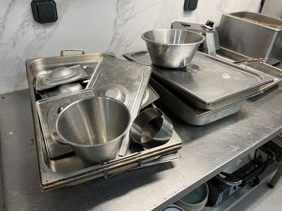 many pans and pans on the counter in the kitchen