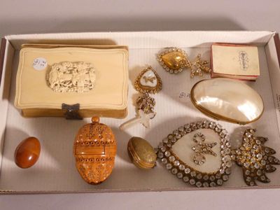 a box filled with assorted jewelry on a table