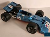 a model of a blue race car on a table