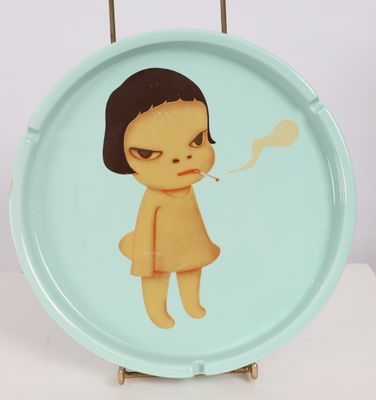 a plate with a picture of a girl smoking a cigarette