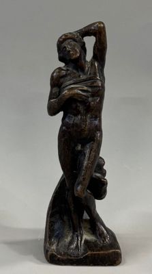 bronze statue of a woman holding a baby in her arms