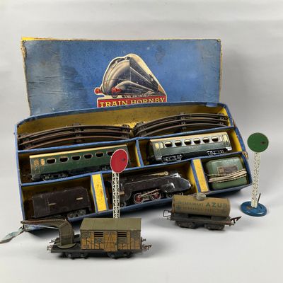 a box with a train set in it on a white surface