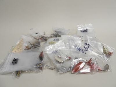 a pile of assorted fishing lures on a table