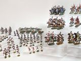 a lot of figurines that are on display on a table