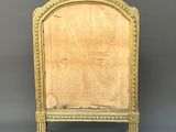 an old wooden chair with a gold frame and a wooden seat